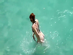 He teaches her how to swim
