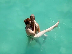 He teaches her how to swim