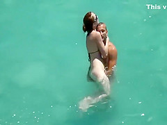 He teaches her how to swim