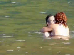 Stones on a naked beach woman