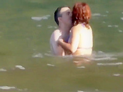 Stones on a naked beach woman