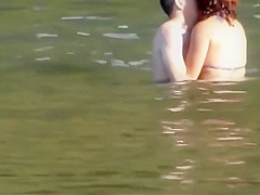 Stones on a naked beach woman