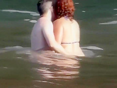 Stones on a naked beach woman