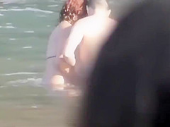 Stones on a naked beach woman