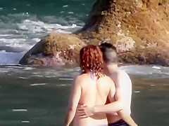 Stones on a naked beach woman