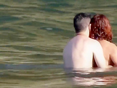 Stones on a naked beach woman