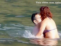 Stones on a naked beach woman