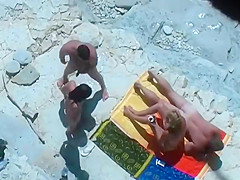 Horny blonde enjoys the beach