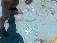 Horny blonde enjoys the beach