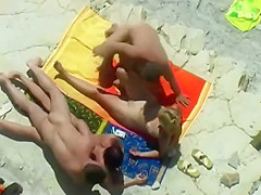 Horny blonde enjoys the beach