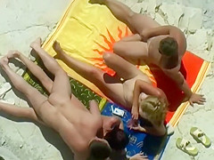 Horny blonde enjoys the beach