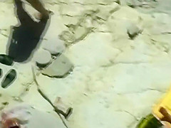 Horny blonde enjoys the beach