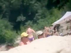 Nudist girl's boobs groped by a guy