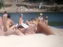 Nudist girl's boobs groped by a guy