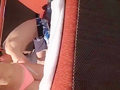 Girl in bikini enjoying music