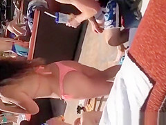 Girl in bikini enjoying music