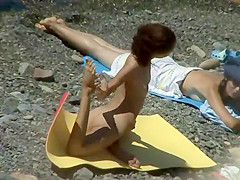 Nudist girl caught doing beach yoga