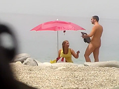 Chubby girl undresses at the beach