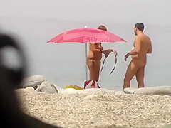 Chubby girl undresses at the beach