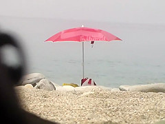 Chubby girl undresses at the beach