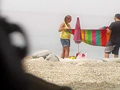 Chubby girl undresses at the beach