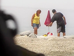 Chubby girl undresses at the beach