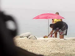 Chubby girl undresses at the beach