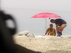 Chubby girl undresses at the beach