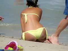 Sexy milf sitting at the beach