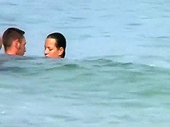 Swinging nudists spied on a beach