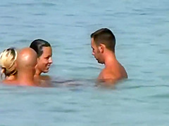 Swinging nudists spied on a beach