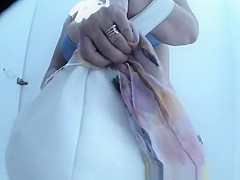 Mature woman caught in beach cabin