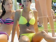 Attractive teen girl scratches her pussy