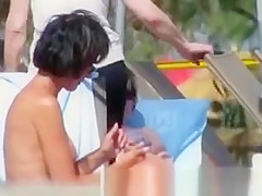 Short hair woman topless at beach