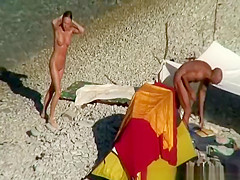 Nude woman swimming and drinking