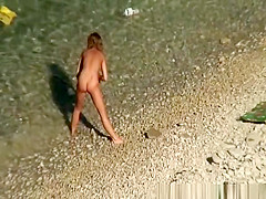 Nude woman swimming and drinking