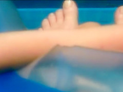 Neighbor lady's pussy spied in her pool