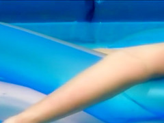 Neighbor lady's pussy spied in her pool