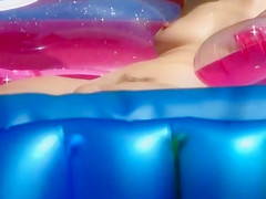 Neighbor lady's pussy spied in her pool