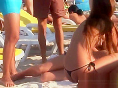 Young topless teens on the beach showing natural firm boobs in public!