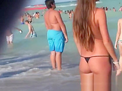 Young topless teens on the beach showing natural firm boobs in public!