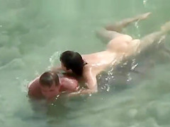 secret voyeur in the water at beach