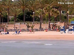 Tied up busty Spanish blonde on the beach