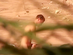 Naughty amateur nudists having sex on the voyeur beach