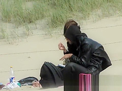 Chick on a nudist beach tanning and bending a nudist beach v