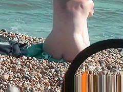 Chick on a nudist beach tanning and bending a nudist beach v