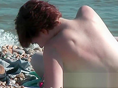 Chick on a nudist beach tanning and bending a nudist beach v