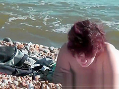 Chick on a nudist beach tanning and bending a nudist beach v