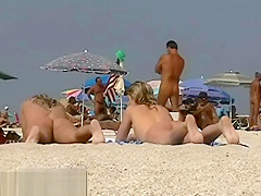 Blonde cutie undressing nudist beach voyeur video