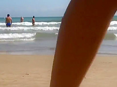 Amazing baby getting naked on the beach